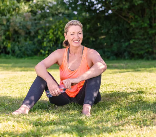 Happy Woman sitting on the beach